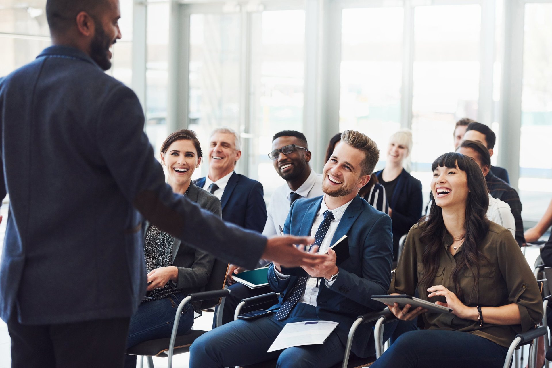 Shot of a young businessman delivering a speech during a conference